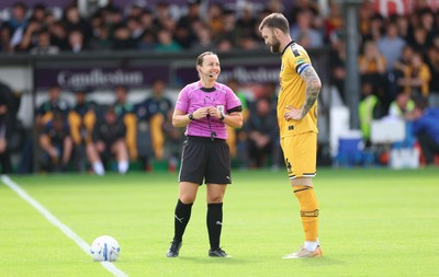 290826 Newport County v Tranmere Rovers, EFL Sky Bet League 2 - Referee Emily Heaslip with Kyle Cameron of Newport County at the start of the match