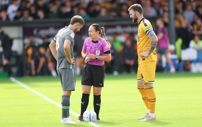 290826 Newport County v Tranmere Rovers, EFL Sky Bet League 2 - Referee Emily Heaslip with captains Will Vaulks of Tranmere Rovers and  Kyle Cameron of Newport County at the start of the match
