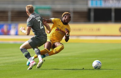 290826 Newport County v Tranmere Rovers, EFL Sky Bet League 2 - Shaquille Gwengwe of Newport County is brought down by Joel Senior of Tranmere Rovers