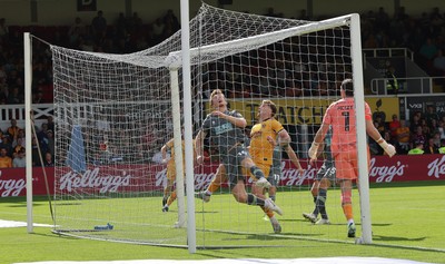 290826 Newport County v Tranmere Rovers, EFL Sky Bet League 2 - Bobby Faulkner of Tranmere Rovers fails to keep the header from Shaquille Gwengwe of Newport County out of the goal as County score the opening goal