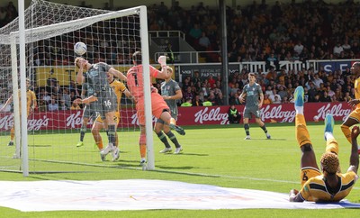 290826 Newport County v Tranmere Rovers, EFL Sky Bet League 2 - Bobby Faulkner of Tranmere Rovers fails to keep the header from Shaquille Gwengwe of Newport County, right edge of frame, out of the goal as County score the opening goal