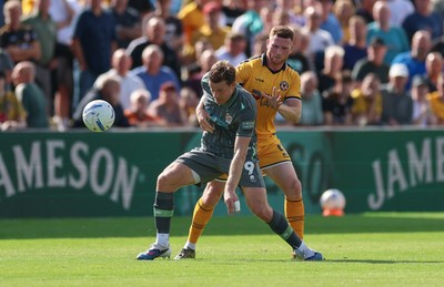 290826 Newport County v Tranmere Rovers, EFL Sky Bet League 2 - Joe Ironside of Tranmere Rovers and Lee Jenkins of Newport County compete for the ball