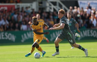 290826 Newport County v Tranmere Rovers, EFL Sky Bet League 2 - Shaquille Gwengwe of Newport County takes on Bobby Faulkner of Tranmere Rovers
