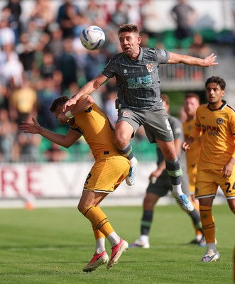290826 Newport County v Tranmere Rovers, EFL Sky Bet League 2 - Sam Finley of Tranmere Rovers challenges Cameron Norman of Newport County for the ball