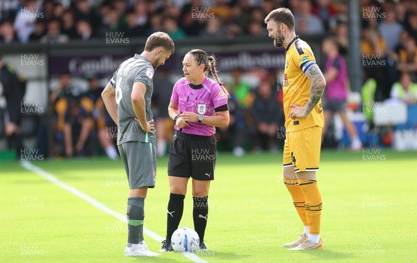 290826 Newport County v Tranmere Rovers, EFL Sky Bet League 2 - Referee Emily Heaslip with captains Will Vaulks of Tranmere Rovers and  Kyle Cameron of Newport County at the start of the match
