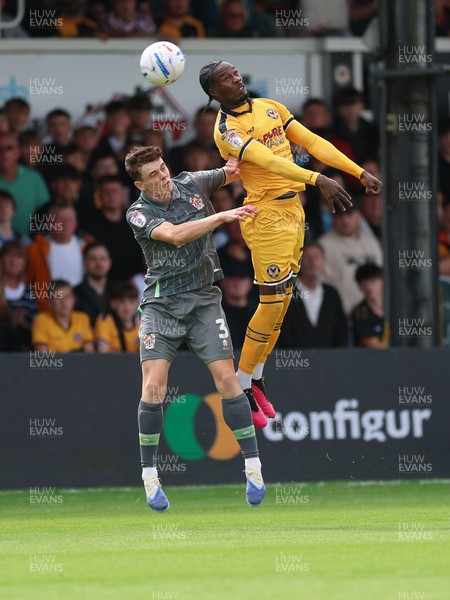 290826 Newport County v Tranmere Rovers, EFL Sky Bet League 2 - Yahya Bamba of Newport County and Jacob Slater of Tranmere Rovers compete for the ball