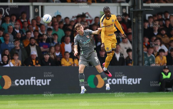 290826 Newport County v Tranmere Rovers, EFL Sky Bet League 2 - Yahya Bamba of Newport County and Jacob Slater of Tranmere Rovers compete for the ball