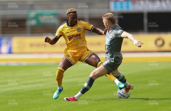 290826 Newport County v Tranmere Rovers, EFL Sky Bet League 2 - Shaquille Gwengwe of Newport County is brought down by Joel Senior of Tranmere Rovers