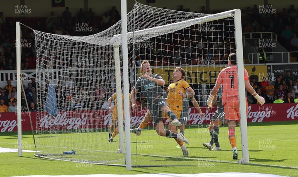290826 Newport County v Tranmere Rovers, EFL Sky Bet League 2 - Bobby Faulkner of Tranmere Rovers fails to keep the header from Shaquille Gwengwe of Newport County out of the goal as County score the opening goal