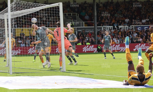 290826 Newport County v Tranmere Rovers, EFL Sky Bet League 2 - Bobby Faulkner of Tranmere Rovers fails to keep the header from Shaquille Gwengwe of Newport County, right edge of frame, out of the goal as County score the opening goal