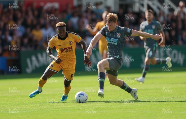 290826 Newport County v Tranmere Rovers, EFL Sky Bet League 2 - Shaquille Gwengwe of Newport County takes on Bobby Faulkner of Tranmere Rovers