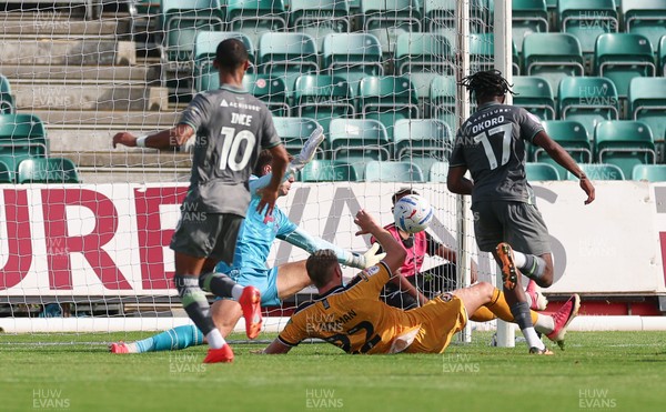 290826 Newport County v Tranmere Rovers, EFL Sky Bet League 2 - Zane Okoro of Tranmere Rovers beats Newport County goalkeeper Jordan Wright to score goal