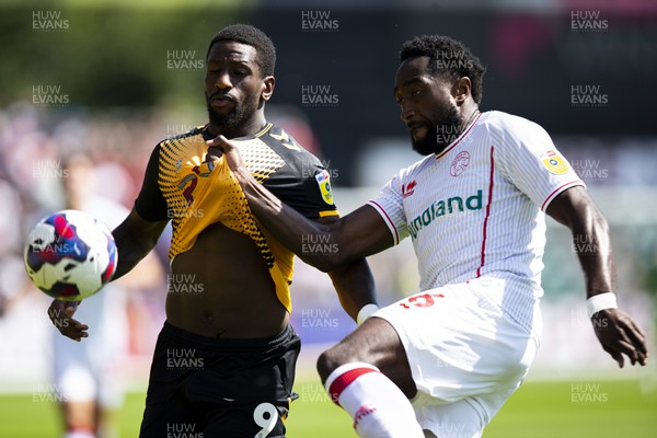 050822 - Newport County v Walsall - Sky Bet League 2 - Omar Boglel of Newport County in action against Emmanuel Monthe of Walsall