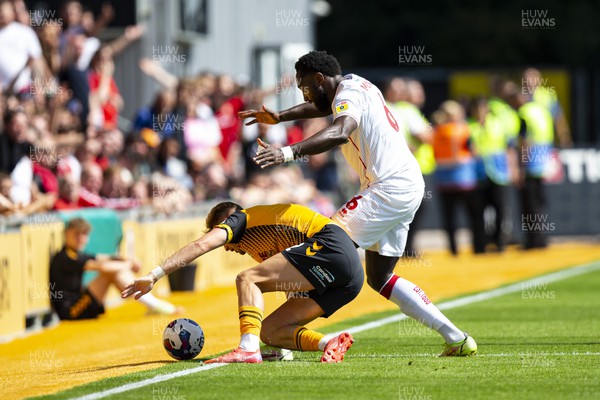 050822 - Newport County v Walsall - Sky Bet League 2 - Cameron Norman of Newport County in action against Emmanuel Monthe of Walsall