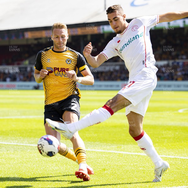 050822 - Newport County v Walsall - Sky Bet League 2 - Cameron Norman of Newport County in action against Taylor Allen of Walsall
