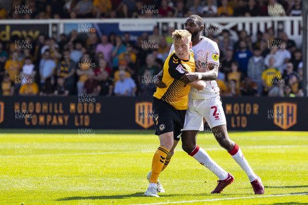 050822 - Newport County v Walsall - Sky Bet League 2 - Will Evans of Newport County is held by Hayden White of Walsall