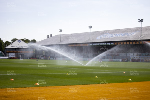 050822 - Newport County v Walsall - Sky Bet League 2 - Sprinklers water the Rodney Parade pitch during the warm up