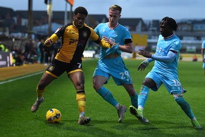 081125 - Newport County v Walsall - Sky Bet League 2 - Bobby Kamwa of Newport County is challenged by Ryan Finnigan of Walsall