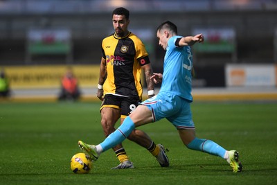 081125 - Newport County v Walsall - Sky Bet League 2 - Courtney Baker-Richardson of Newport County is challenged by Mason Hancock of Walsall