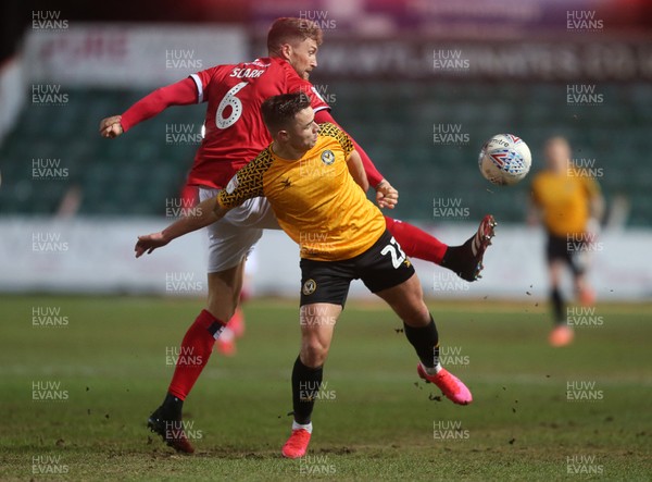 110220 - Newport County v Walsall - SkyBet League Two - Billy Waters of Newport County is tackled by Dan Scarr of Walsall