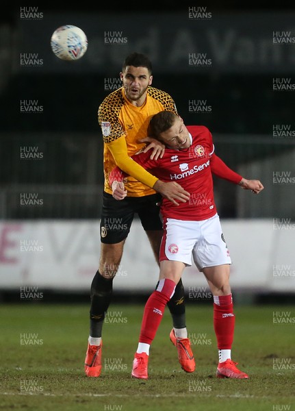 110220 - Newport County v Walsall - SkyBet League Two - Ryan Innis of Newport County and Caolan Lavery of Walsall go for the header