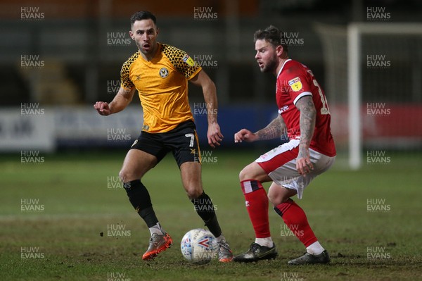 110220 - Newport County v Walsall - SkyBet League Two - Robbie Willmott of Newport County passes the ball past Danny Guthrie of Walsall