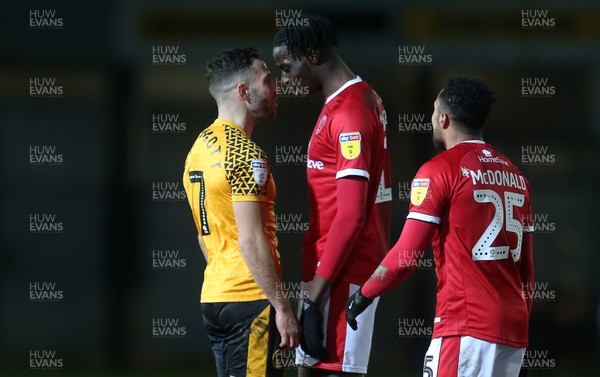 110220 - Newport County v Walsall - SkyBet League Two - Robbie Willmott of Newport County and Elijah Adebayo of Walsall front up to each other