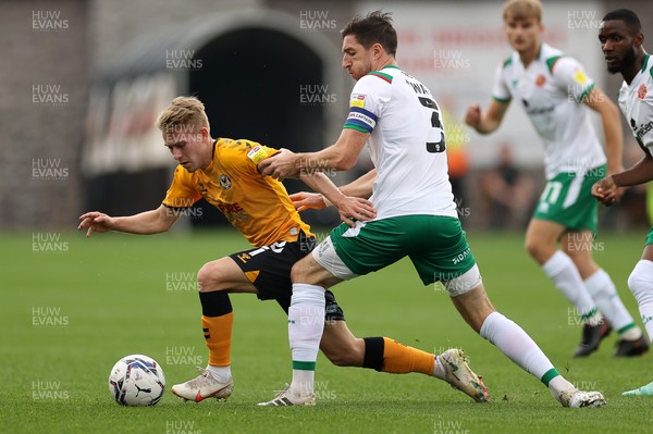 180921 - Newport County v Walsall - SkyBet League Two - Ollie Cooper of Newport County is challenged by Stephen Ward of Walsall