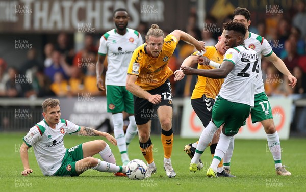 180921 - Newport County v Walsall - SkyBet League Two - Alex Fisher of Newport County gets past Rollin Menayese of Walsall