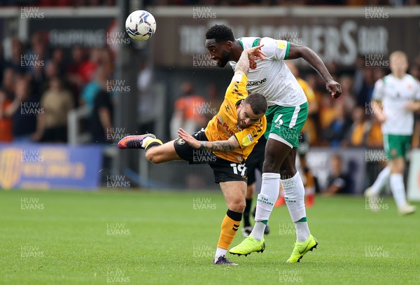 180921 - Newport County v Walsall - SkyBet League Two - Dom Telford of Newport County is challenged by Emmanuel Monthe of Walsall