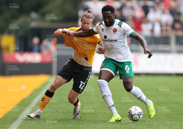 180921 - Newport County v Walsall - SkyBet League Two - Alex Fisher of Newport County is tackled by Emmanuel Monthe of Walsall