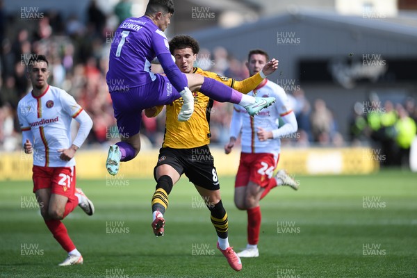 210425 - Newport County v Walsall - Sky Bet League 2 - Josh Martin of Newport County is taken out by Tommy Simkin of Walsall