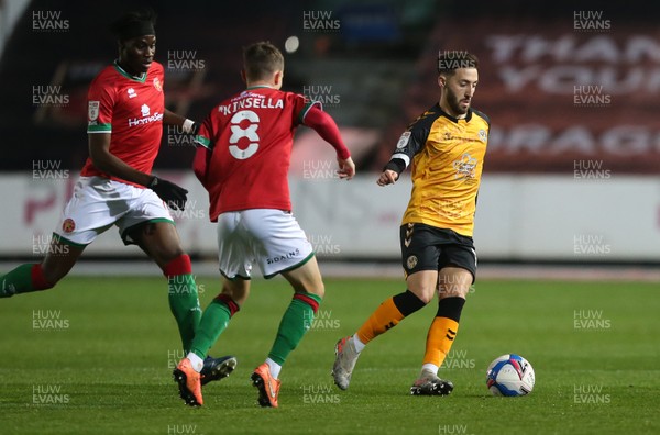 241120 - Newport County v Walsall - SkyBet League Two - Josh Sheehan of Newport County is challenged by Liam Kinsella of Walsall