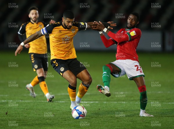 241120 - Newport County v Walsall - SkyBet League Two - Joss Labadie of Newport County is challenged by Emmanuel Osadebe of Walsall