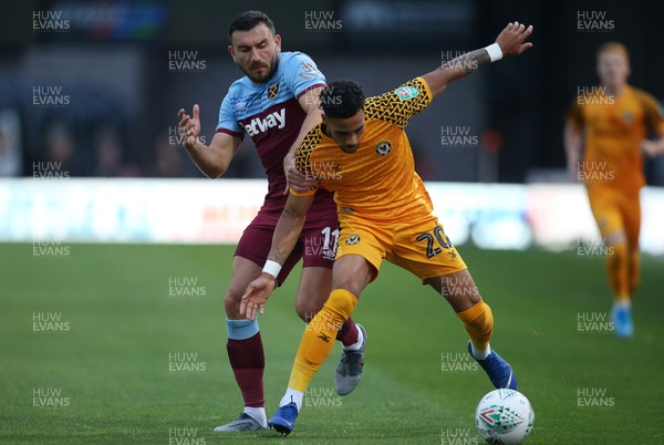 270819 - Newport County v West Ham United - Carabao Cup - Corey Whitely of Newport County is challenged by Robert Snodgrass of West Ham