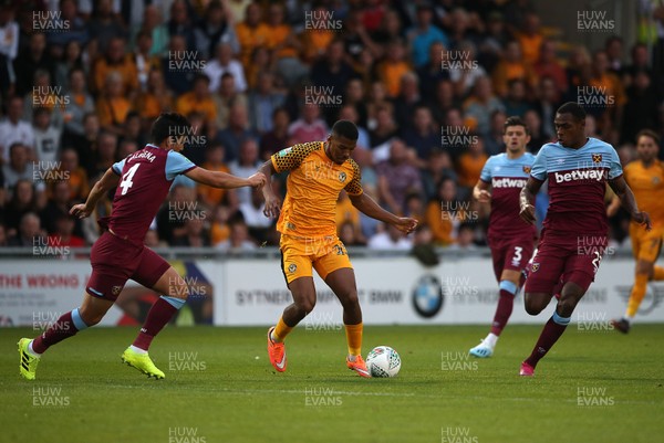 270819 - Newport County v West Ham United - Carabao Cup - Tristan Abrahams of Newport County is challenged by Fabian Balbuena of West Ham