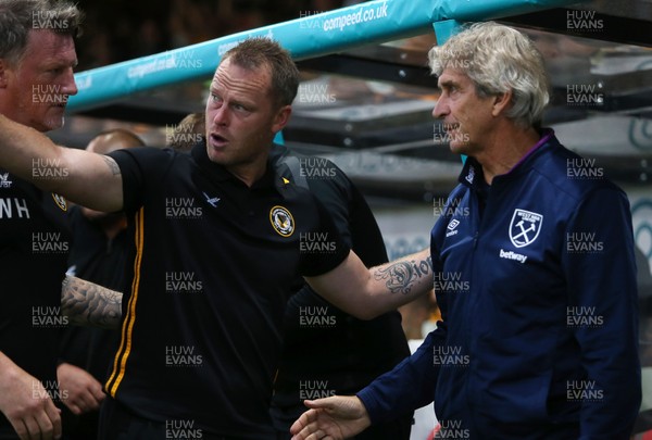 270819 - Newport County v West Ham United - Carabao Cup - Newport County Manager Michael Flynn and West Ham Manager Manuel Pellegrin