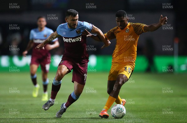 270819 - Newport County v West Ham United - Carabao Cup - Tristan Abrahams of Newport County is challenged by Robert Snodgrass of West Ham