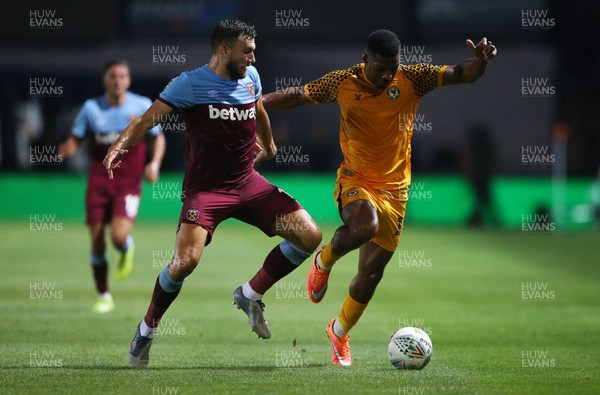 270819 - Newport County v West Ham United - Carabao Cup - Tristan Abrahams of Newport County is challenged by Robert Snodgrass of West Ham
