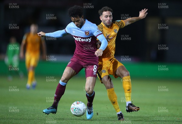 270819 - Newport County v West Ham United - Carabao Cup - Felipe Anderson of West Ham is challenged by Robbie Willmott of Newport County
