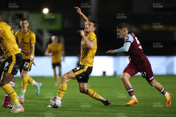 311023 - Newport County v West Ham United U21s - Carabao Cup - Ryan Delaney of Newport County is challenged by Daniel Chesters of West Ham