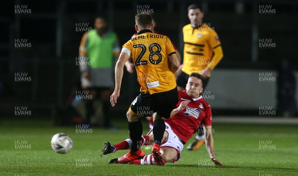 111218 - Newport County v Wrexham AFC - FA Cup Second Round Replay - Mickey Demetriou of Newport County is tackled by Luke Young of Wrexham who is given a red card