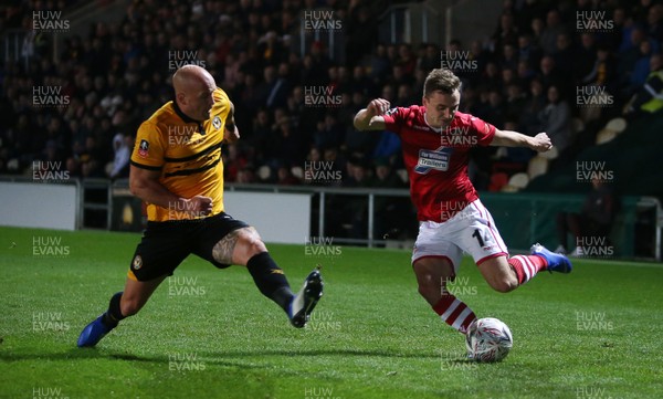 111218 - Newport County v Wrexham AFC - FA Cup Second Round Replay - Paul Rutherford of Wrexham has his cross blocked by David Pipe of Newport County