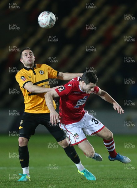 111218 - Newport County v Wrexham AFC - FA Cup Second Round Replay - Matthew Dolan of Newport County is challenged by Bobby Grant of Wrexham