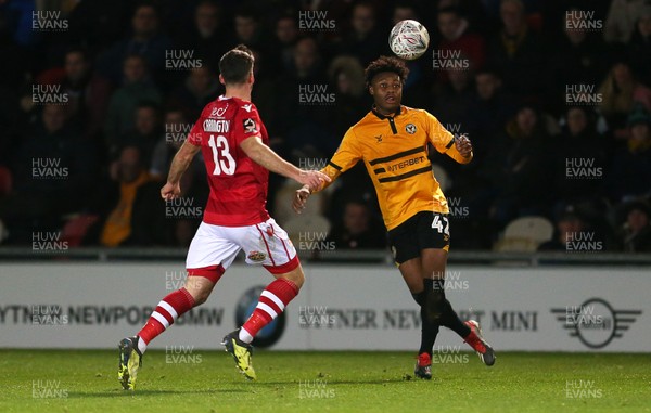 111218 - Newport County v Wrexham AFC - FA Cup Second Round Replay - Antoine Semenyo of Newport County is challenged by Mark Carrington of Wrexham