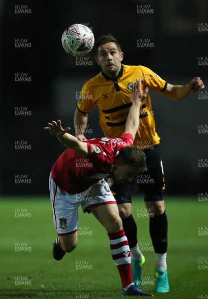 111218 - Newport County v Wrexham, FA Cup Round 2 Replay - Luke Young of Wrexham and Matt Dolan of Newport County compete for the ball