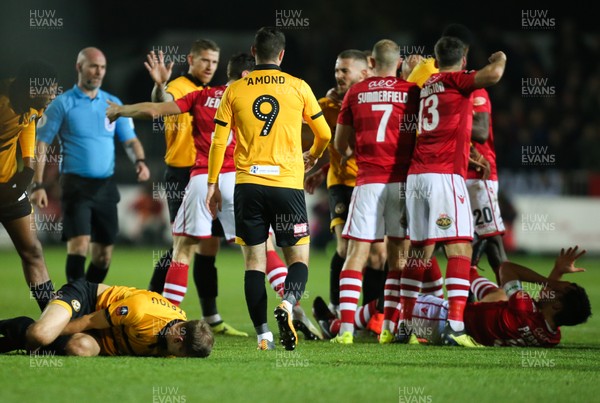 111218 - Newport County v Wrexham, FA Cup Round 2 Replay - Players scuffle after Luke Young of Wrexham is shown a red card for his tackle on Mickey Demetriou of Newport County