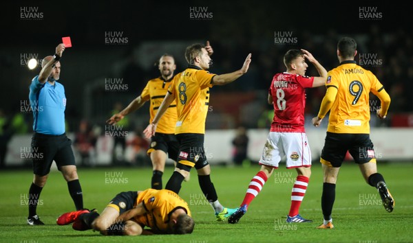 111218 - Newport County v Wrexham, FA Cup Round 2 Replay - Luke Young of Wrexham is shown a red card for his tackle on Mickey Demetriou of Newport County