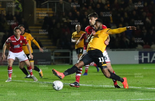 111218 - Newport County v Wrexham, FA Cup Round 2 Replay - Jamille Matt of Newport County stretches for the ball as Shaun Pearson of Wrexham challenges