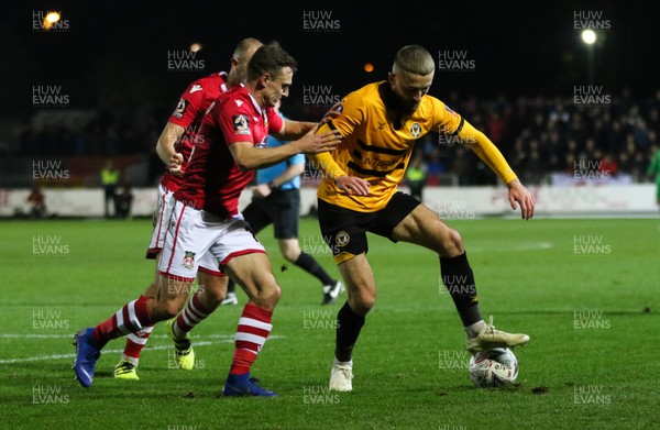 111218 - Newport County v Wrexham, FA Cup Round 2 Replay - Dan Butler of Newport County takes on Paul Rutherford of Wrexham